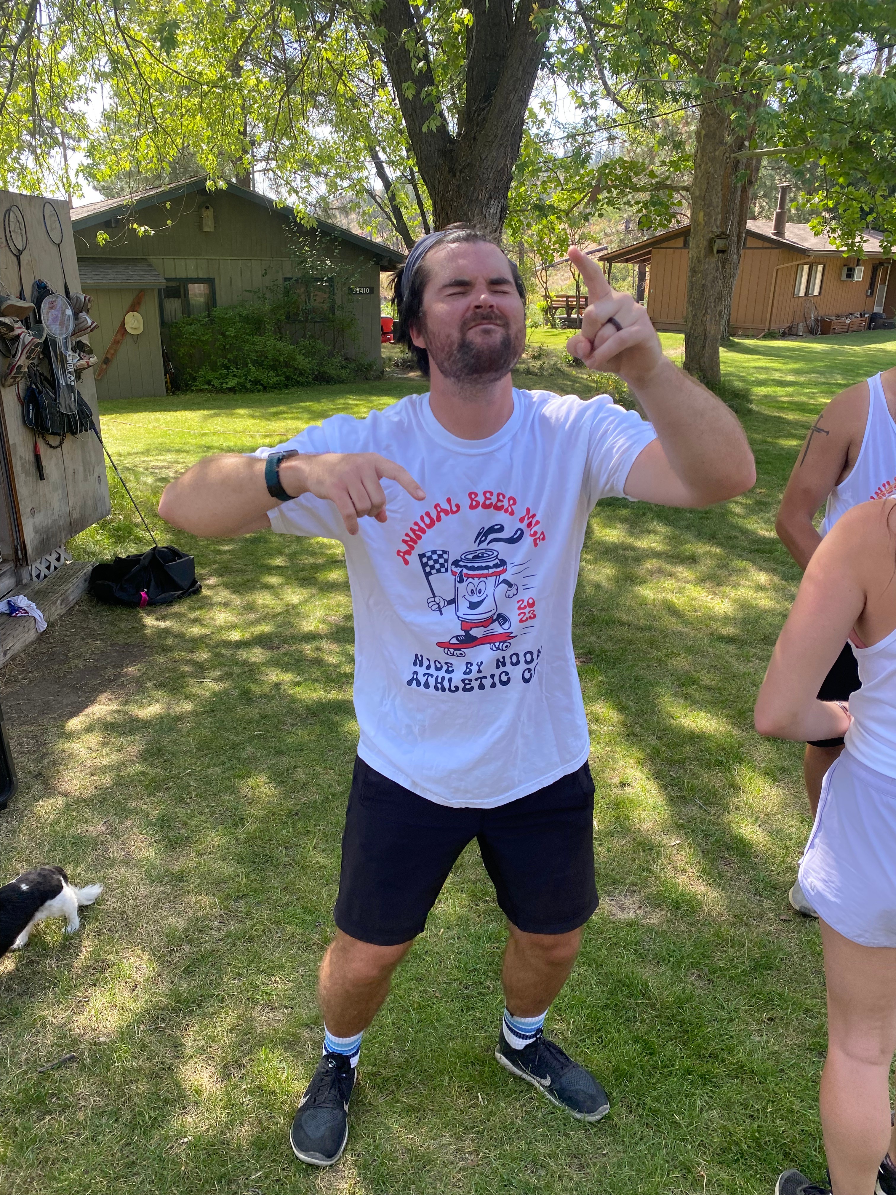Guy celebrating after 5K race. 